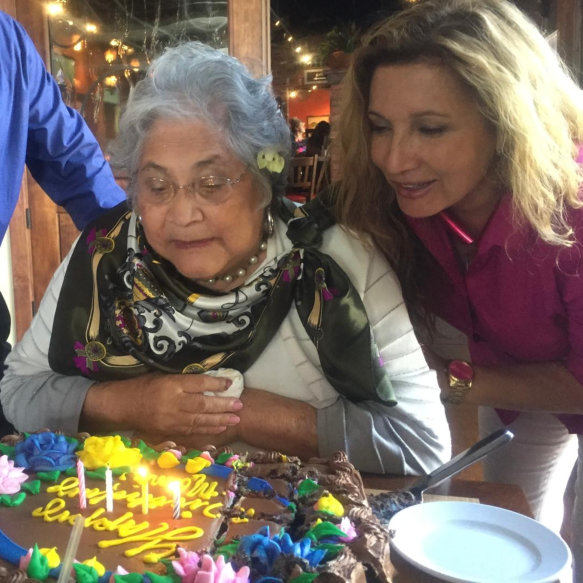 woman and elderly woman smiling