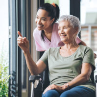 elderly woman pointing outside