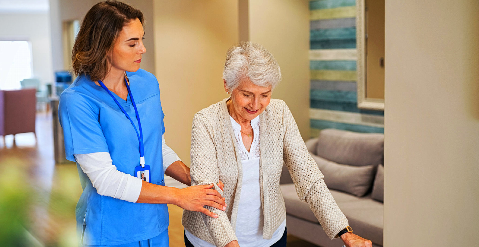 caretaker guide the elderly woman