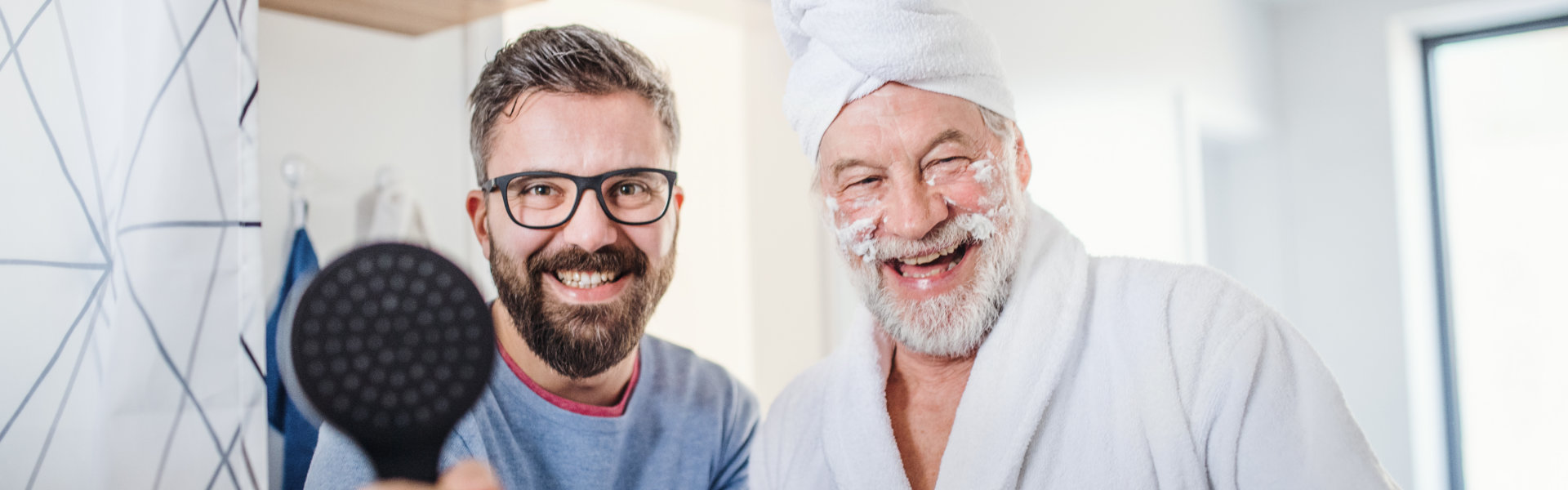 aide and elderly man smiling
